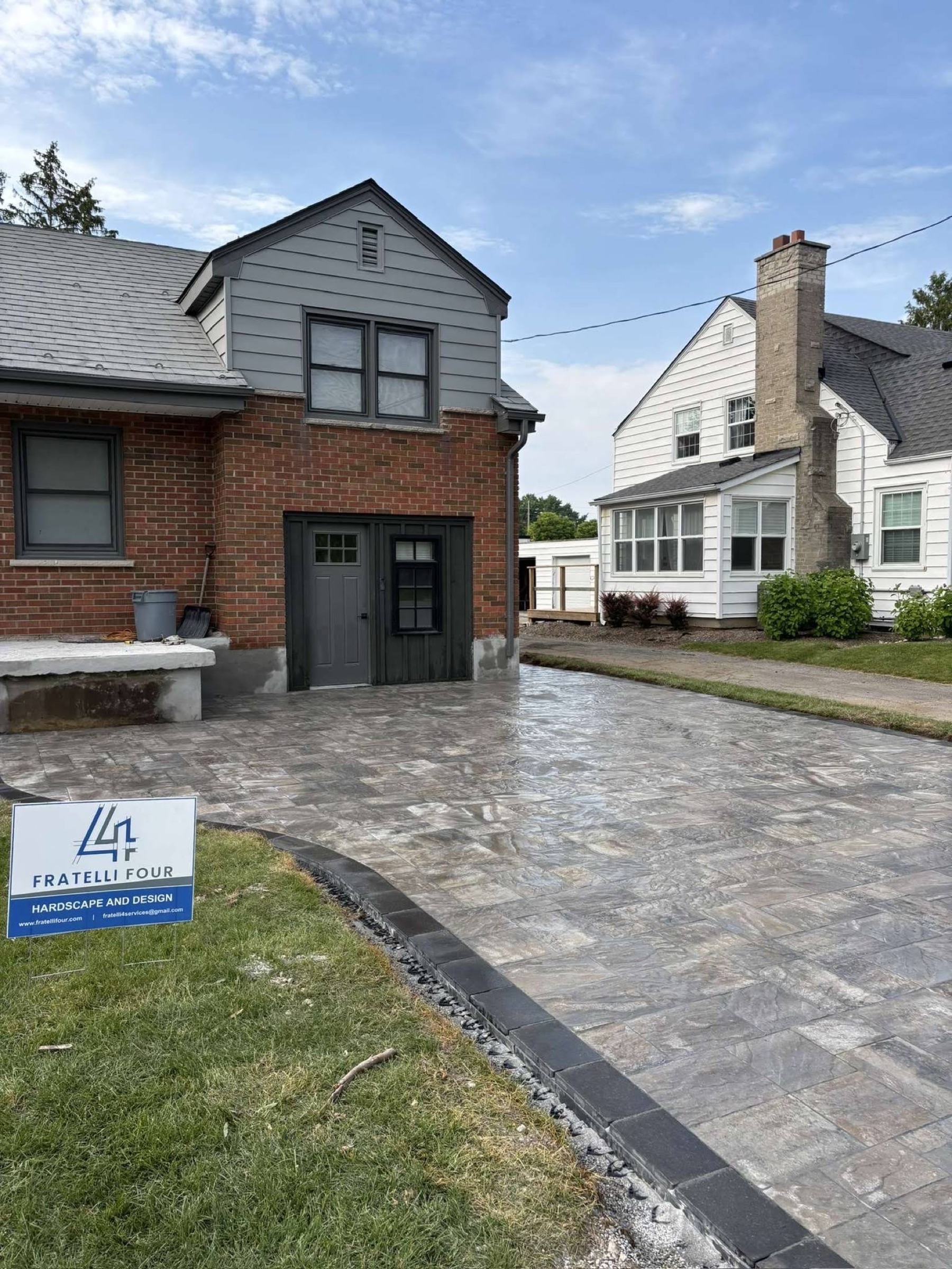 Finished interlock driveway with a Fratelli Four sign